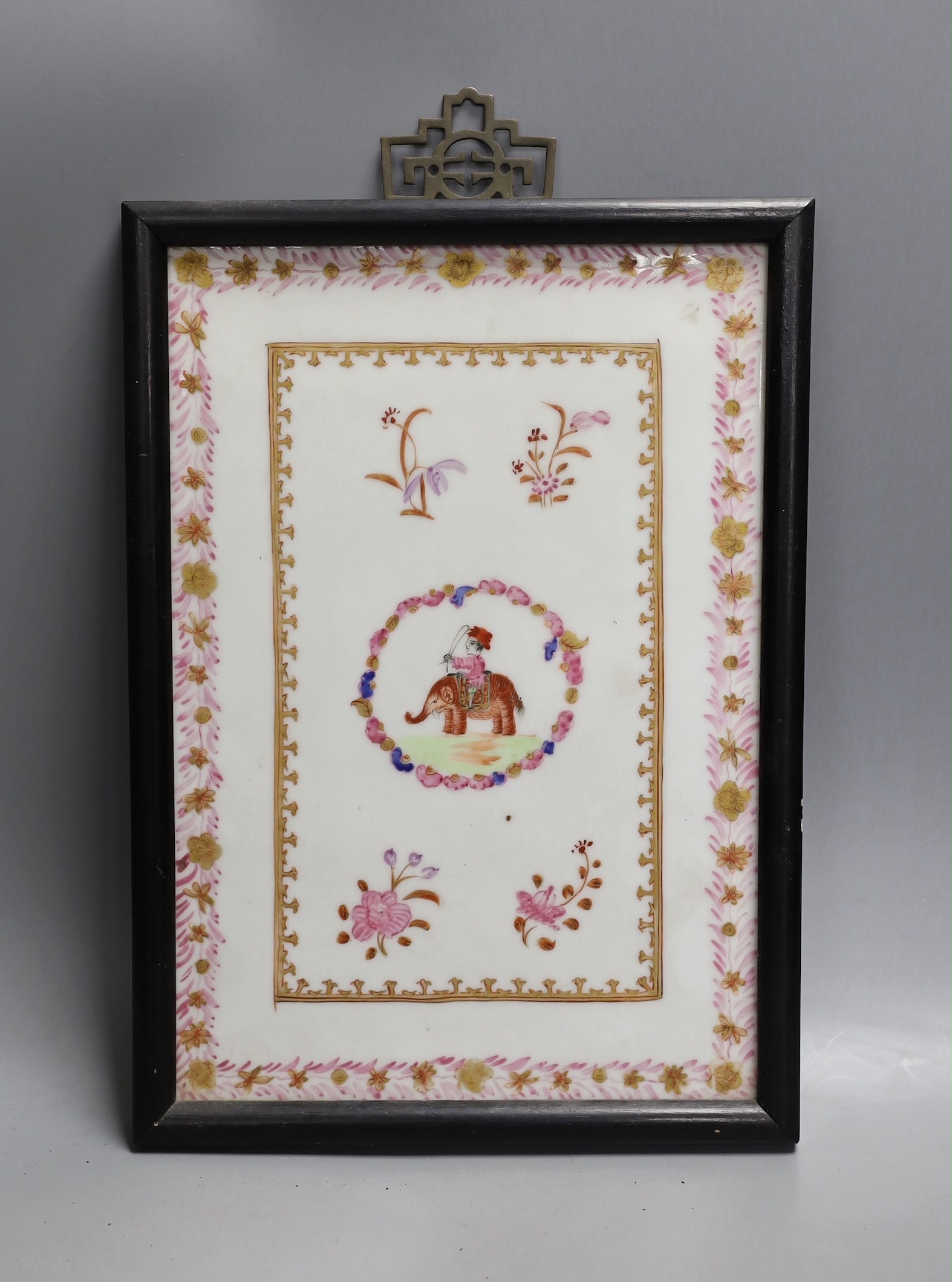 A framed Chinese export style famille rose porcelain plaque, 25x17cm